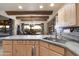 Eat-in kitchen with wood cabinetry, granite counters, and views to backyard at 5730 E Cielo N Run, Cave Creek, AZ 85331