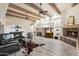 Relaxing living area with a cozy fireplace, rustic decor, and ample natural light at 5730 E Cielo N Run, Cave Creek, AZ 85331