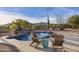 Inviting pool with a waterfall, chairs, and stunning desert views at 5730 E Cielo N Run, Cave Creek, AZ 85331