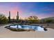 Relaxing pool and spa with waterfall feature and desert backdrop at 5730 E Cielo N Run, Cave Creek, AZ 85331