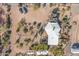 Aerial view of a house with a white roof and surrounding desert landscape at 6013 E Lost Dutchman Blvd, Apache Junction, AZ 85119