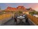 Private deck with glass-top table and chairs offering scenic mountain views at 6013 E Lost Dutchman Blvd, Apache Junction, AZ 85119