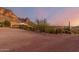 Home exterior with mountain backdrop at sunset at 6013 E Lost Dutchman Blvd, Apache Junction, AZ 85119