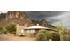 House exterior showcasing a southwestern style home with mountain views at 6013 E Lost Dutchman Blvd, Apache Junction, AZ 85119