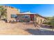 Southwest style home with mountain backdrop, inviting entry, and desert landscaping at 6013 E Lost Dutchman Blvd, Apache Junction, AZ 85119