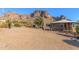 Desert home exterior with mountain views, inviting entryway, and landscaping at 6013 E Lost Dutchman Blvd, Apache Junction, AZ 85119