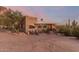 Front view of charming home with sunset backdrop at 6013 E Lost Dutchman Blvd, Apache Junction, AZ 85119