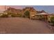 House exterior, mountain backdrop at sunset at 6013 E Lost Dutchman Blvd, Apache Junction, AZ 85119