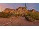 Desert landscape home exterior at sunset at 6013 E Lost Dutchman Blvd, Apache Junction, AZ 85119