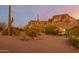 Desert landscape home with mountain views, cacti, and spacious yard at 6013 E Lost Dutchman Blvd, Apache Junction, AZ 85119