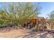 Unique desert home exterior with wooden walkway at 6013 E Lost Dutchman Blvd, Apache Junction, AZ 85119