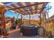 Covered patio with hot tub, perfect for relaxation at 6013 E Lost Dutchman Blvd, Apache Junction, AZ 85119