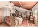 Living room with wood-beamed ceiling, fireplace, and southwestern decor at 6013 E Lost Dutchman Blvd, Apache Junction, AZ 85119