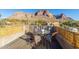 Enjoy mountain views from this charming patio with seating for four at 6013 E Lost Dutchman Blvd, Apache Junction, AZ 85119