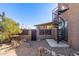 Modern spiral staircase leading to upper level, desert setting at 6013 E Lost Dutchman Blvd, Apache Junction, AZ 85119