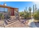 Steps leading to the front entrance with metal railing and desert plants at 6013 E Lost Dutchman Blvd, Apache Junction, AZ 85119