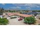 Aerial view of single-story home with large yard and mountain backdrop at 6052 N 183Rd Ave, Waddell, AZ 85355