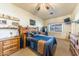 Cozy bedroom with a wooden bed frame and built-in shelves at 6052 N 183Rd Ave, Waddell, AZ 85355