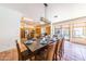 Open dining area with large wooden table and kitchen views at 6052 N 183Rd Ave, Waddell, AZ 85355