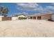 Front exterior view of a home with a three-car garage at 6052 N 183Rd Ave, Waddell, AZ 85355