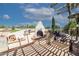 Outdoor stucco fireplace with raised seating and wood storage at 6052 N 183Rd Ave, Waddell, AZ 85355