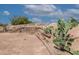 Landscaped garden with cacti and unique rock formations at 6052 N 183Rd Ave, Waddell, AZ 85355