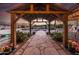 Stone pathway leading through a covered walkway at 6052 N 183Rd Ave, Waddell, AZ 85355