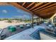 Covered patio with seating area, fire pit, and mountain views at 6052 N 183Rd Ave, Waddell, AZ 85355