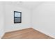 Light-filled bedroom with hardwood floors and large window at 6147 E Alta Hacienda Dr, Scottsdale, AZ 85251