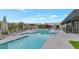 Community pool with lounge chairs and grassy area at 6147 E Alta Hacienda Dr, Scottsdale, AZ 85251