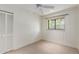 Bright bedroom with ceiling fan, window, and closet at 6319 N Mockingbird Ln, Paradise Valley, AZ 85253