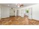 Bedroom with tile floors, double doors to bathroom, and built-in shelving at 6319 N Mockingbird Ln, Paradise Valley, AZ 85253