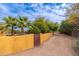 Long private driveway leading to the property with a rustic gate at 6319 N Mockingbird Ln, Paradise Valley, AZ 85253