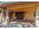 Double wooden doors at the entrance of the home at 6319 N Mockingbird Ln, Paradise Valley, AZ 85253