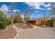 Landscaped front yard with walkway to the house entrance at 6319 N Mockingbird Ln, Paradise Valley, AZ 85253