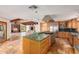 Kitchen with island and stainless steel appliances at 6319 N Mockingbird Ln, Paradise Valley, AZ 85253