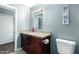 Bathroom with granite countertop and dark wood cabinets at 6622 N 43Rd Ave, Glendale, AZ 85301