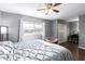 Bedroom with queen bed, window, and walk-in closet at 6622 N 43Rd Ave, Glendale, AZ 85301