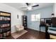 Cozy bedroom with a built-in desk, bookcase, and comfortable seating at 6622 N 43Rd Ave, Glendale, AZ 85301