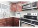 Kitchen corner with granite countertop and stainless steel appliances at 6622 N 43Rd Ave, Glendale, AZ 85301