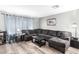 Living room with L-shaped sectional sofa and wood-look floors at 6622 N 43Rd Ave, Glendale, AZ 85301