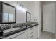 Elegant bathroom with double sink vanity, granite countertop, and marble flooring at 669 S Saddle St, Gilbert, AZ 85233