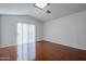 Bright bedroom with wood flooring and sliding glass door access to patio at 669 S Saddle St, Gilbert, AZ 85233