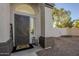 Front entry with decorative door, welcome mat, and lanterns at 669 S Saddle St, Gilbert, AZ 85233