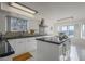 Modern kitchen with white cabinets, granite counters, and island at 669 S Saddle St, Gilbert, AZ 85233