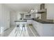 Modern kitchen with white cabinets, granite counters, and island at 669 S Saddle St, Gilbert, AZ 85233