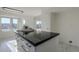 Modern kitchen island with granite countertop and seating at 669 S Saddle St, Gilbert, AZ 85233