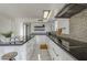 Modern kitchen with white cabinets and granite countertops at 669 S Saddle St, Gilbert, AZ 85233