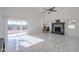 Living area with fireplace, sliding glass doors, and tile floors at 669 S Saddle St, Gilbert, AZ 85233