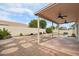 Relaxing backyard with covered patio, pool, and stone pathway at 7138 E Laguna Azul Ave, Mesa, AZ 85209